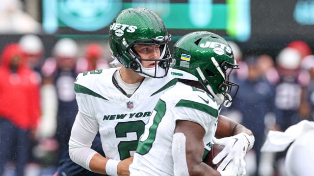 Jets' QB Zach Wilson hands off to RB Breece Hall